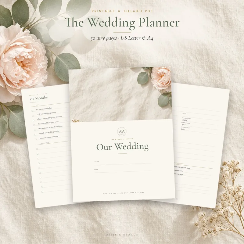 Printable Wedding Planner Binder pages fanned out on linen